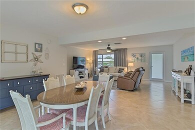 Dining room and living room combo is bright and sp
