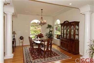 Spacious Formal Dining room with columns.