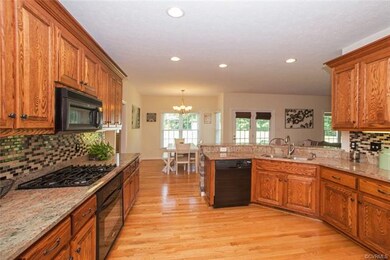 Kitchen with breakfast nook in back ground