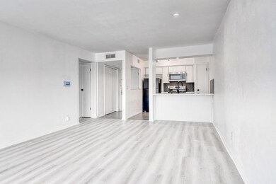Unfurnished living room featuring light wood-type 