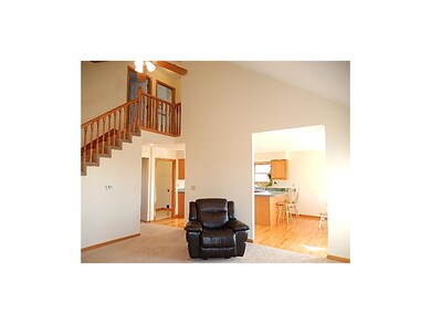 Vaulted great room opens to the kitchen.