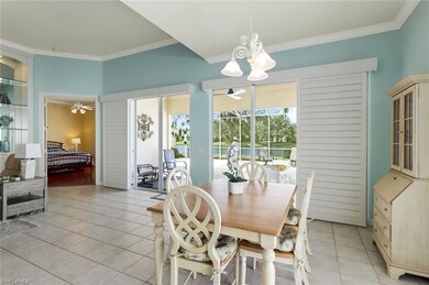 Tiled dining area with ornamental molding and ceil