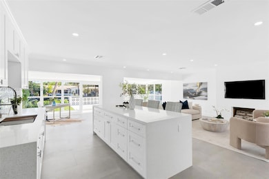 Kitchen featuring beautiful center island with plenty of storage