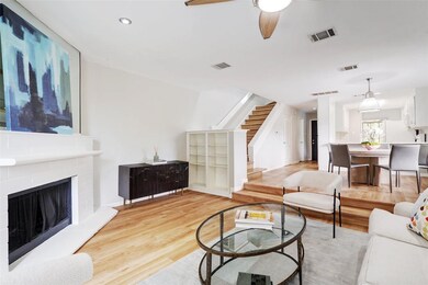 Living area with stairs, wood finished floors, ce