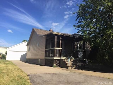 Exterior Front. concrete driveway and 2 car detach