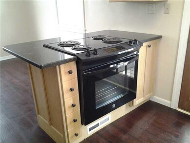 Kitchen. Electric cook top island, to left of stov