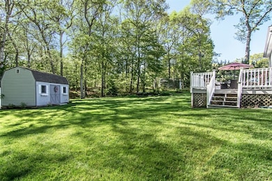 This view shows the large, private back yard with