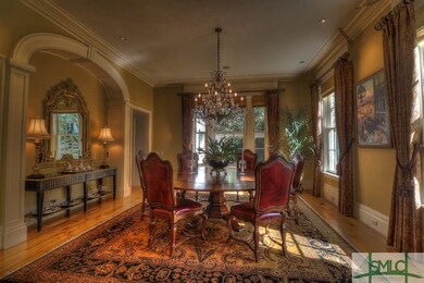 The Formal Dining Room comfortably sits 12 in a li