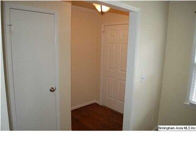Entry foyer shows the hardwood floors.