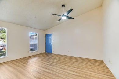 Empty room with light wood-style floors, ceiling 