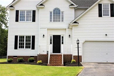 New landscaping and paint for doors and shutters.