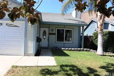 View of the walkway with the custom front door and