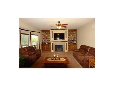 Living room with built-ins and new carpet.