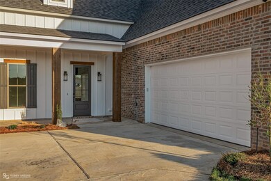 Doorway to property with a garage