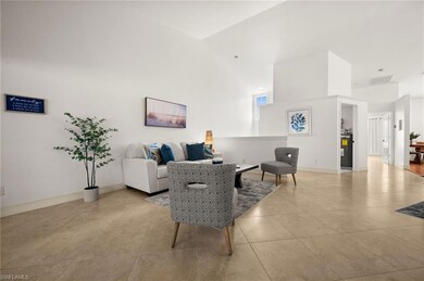Living area featuring light tile patterned floorin