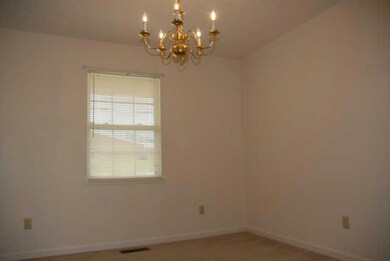 The Formal Dining Room is located just off the Foyer & Kitchen.