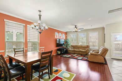 Dedicated Dining Room great for entertaining with a charming chandelier, natural lighting from multiple windows and easy access to the Lovely Living Room.