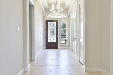 WOW! What a view of the extra wide foyer. To the right is a private doored study and to the left are 2 secondary beds w/ shared bath.