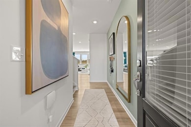 Hallway featuring recessed lighting, light wood-ty