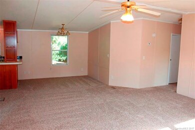 Living room and dining area.  2 BR's and bath to t