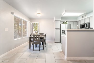virtually decluttered: Dining space featuring ligh