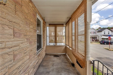 Cozy front porch beckons quiet evenings.