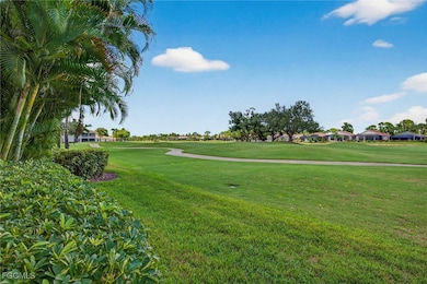 View of property's community with view of golf course, a yard, and a residential view