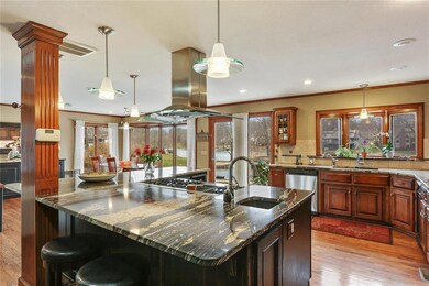 Guests can gather around the HUGE exotic granite i
