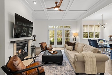 High 12 feet ceiling living room with sun filled windows