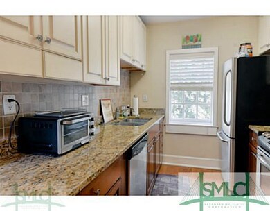 Kitchen. Windows throughout the condo for plenty o
