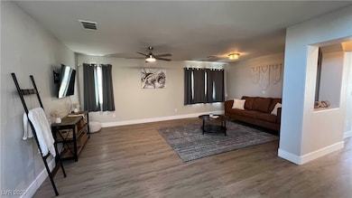 Living area featuring wood finished floors, ceilin