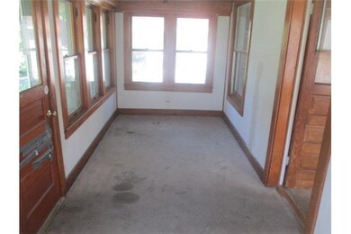 Exterior Front. Enclosed porch