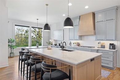 eat-in kitchen with oversized quartz island