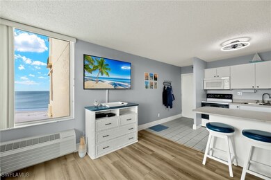Kitchen with light countertops, light wood-style f
