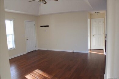 The living area has brand new flooring and a drama