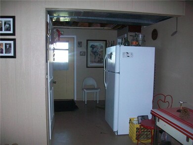 Basement hallway to walkout entry.