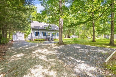 View of front of property with a front lawn, a sto