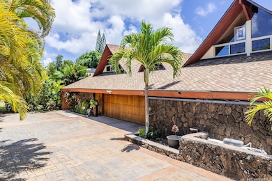 Spacious garage with Koa wood garage door