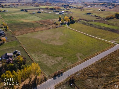 Aerial view of property and surrounding area featuring rural landscape