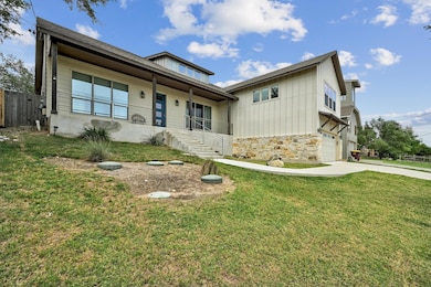 View of front of home with concrete driveway, an 