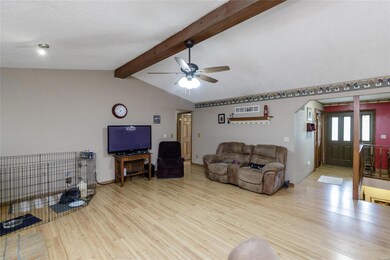The front door leads to a foyer area and stairs to