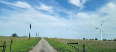 View of dirt / gravel road featuring a rural view