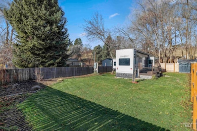 Fenced backyard featuring a wooden deck