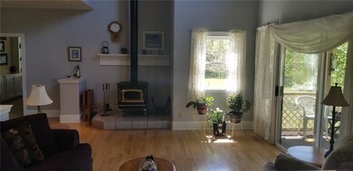 Roomy Great Room with high ceilings and hardwood f