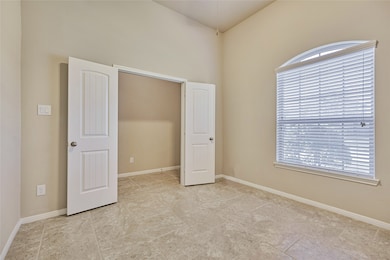 The first room on the left could make a great study or be used as a formal dining room.  It has a large arched window giving you plentiful light and a great view of the front yard.