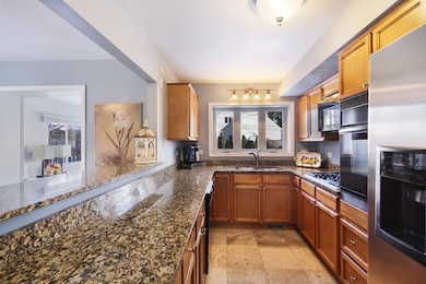 Updated kitchen. Granite counter tops. Travertine 