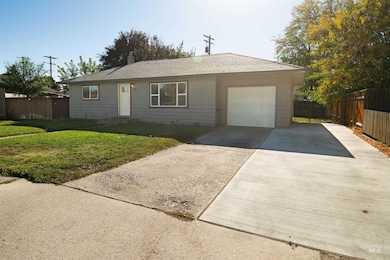 Single story home with driveway and a chimney