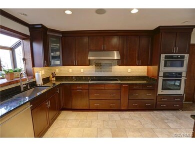 Chef's Kitchen with granite countertops, stainless