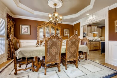 Formal dining room located off of foyer area. Easy access to the kitchen.  Plantation shutters are on the front of the home.  Exceptional trey ceiling w/chandelier.
