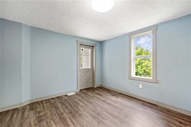 Back door enters into the Kitchen